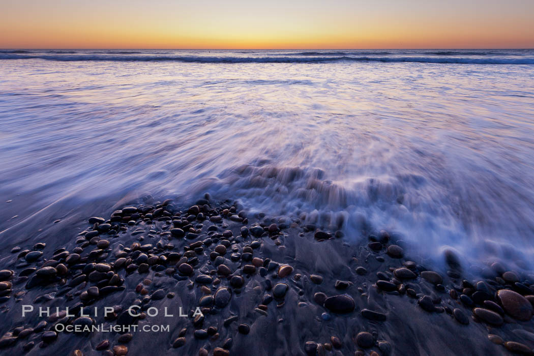 Sunset and incoming surf, gorgeous colors in the sky and on the ocean at dusk, the incoming waves are blurred in this long exposure. Carlsbad, California, USA, natural history stock photograph, photo id 27191