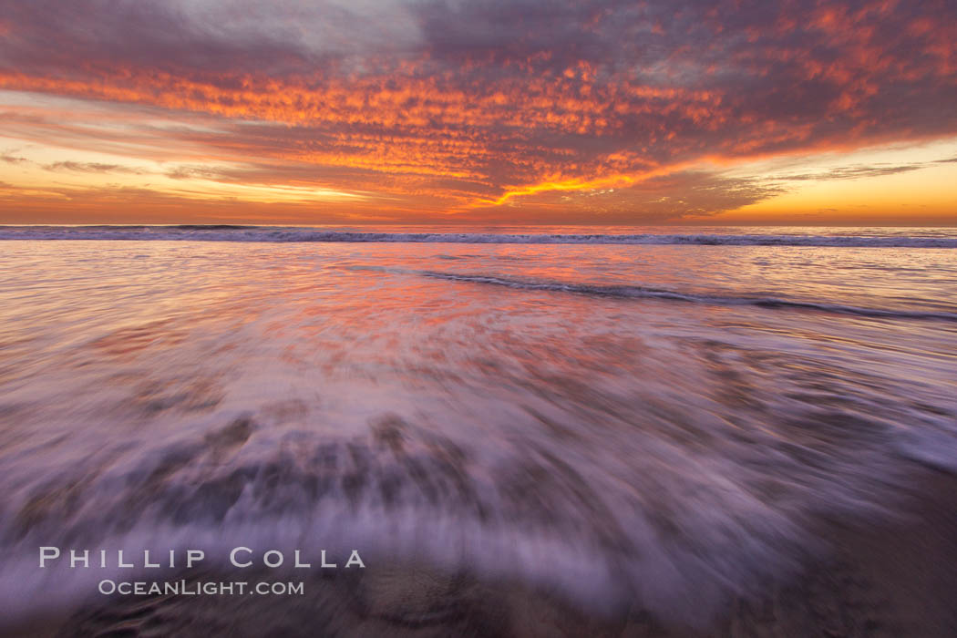 Sunset and incoming surf, gorgeous colors in the sky and on the ocean at dusk, the incoming waves are blurred in this long exposure. Carlsbad, California, USA, natural history stock photograph, photo id 27157