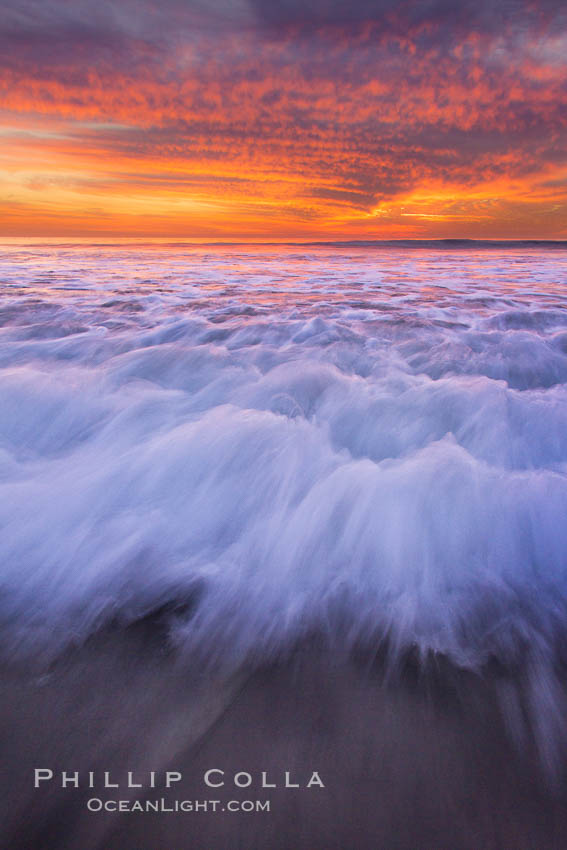 Sunset and incoming surf, gorgeous colors in the sky and on the ocean at dusk, the incoming waves are blurred in this long exposure. Carlsbad, California, USA, natural history stock photograph, photo id 27161