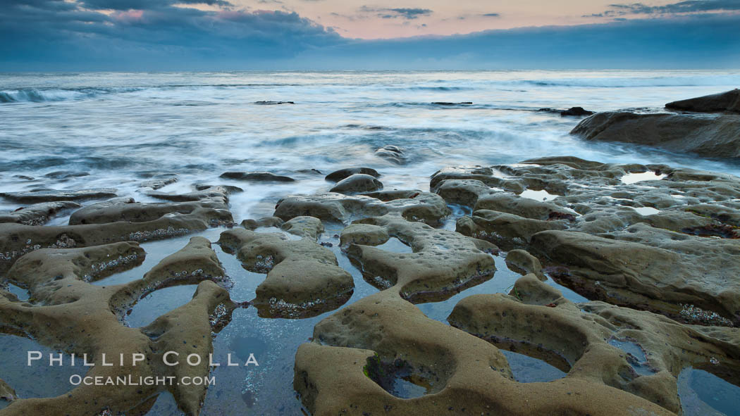 Waves wash over sandstone reef, clouds and sky. La Jolla, California, USA, natural history stock photograph, photo id 26346