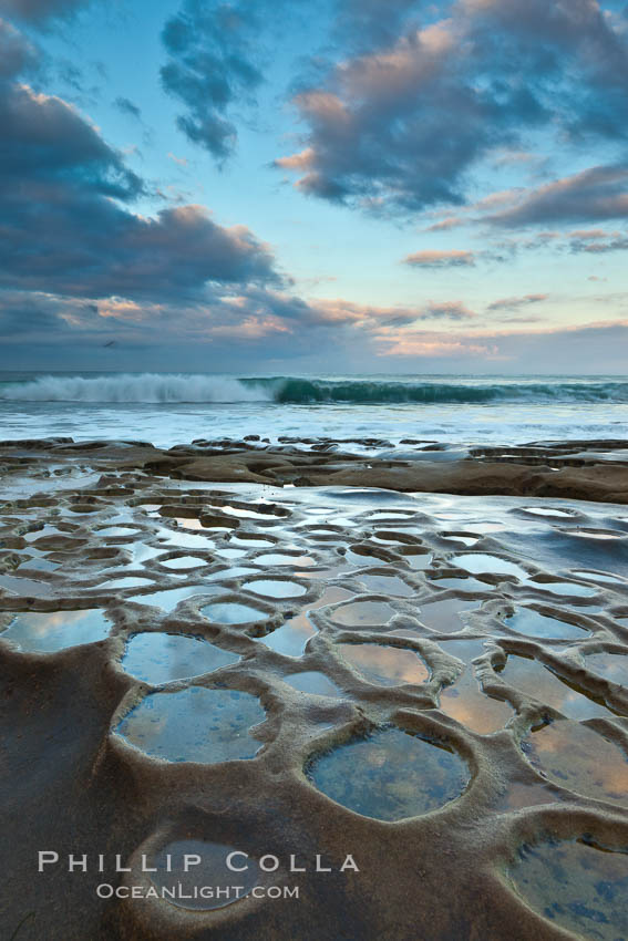 Waves wash over sandstone reef, clouds and sky. La Jolla, California, USA, natural history stock photograph, photo id 26337