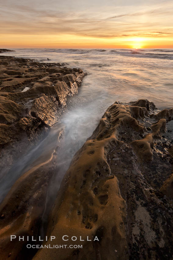 Waves wash over sandstone reef, clouds and sky. La Jolla, California, USA, natural history stock photograph, photo id 26453