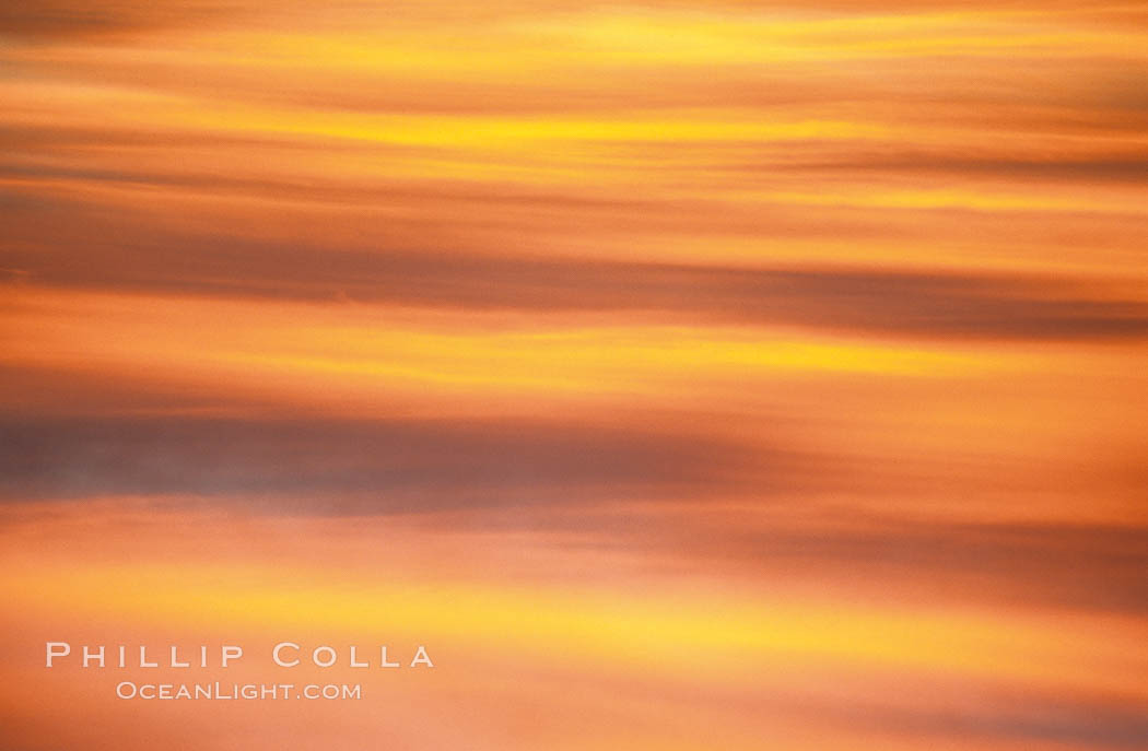 Clouds light up with blazing colors at sunset, La Jolla, California