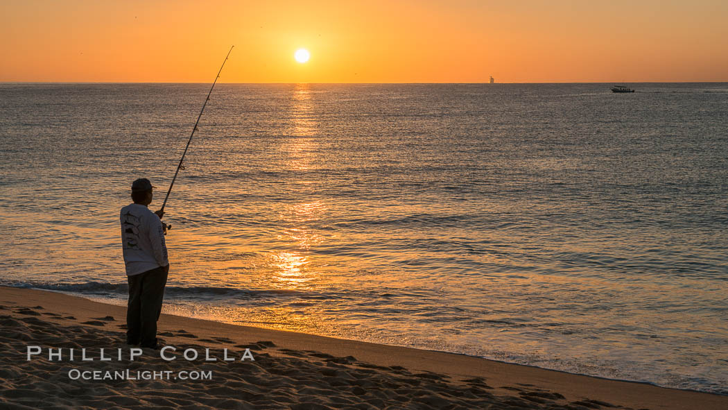 Surf fisherman on Medano Beach at sunrise, Cabo San Lucas, Mexico