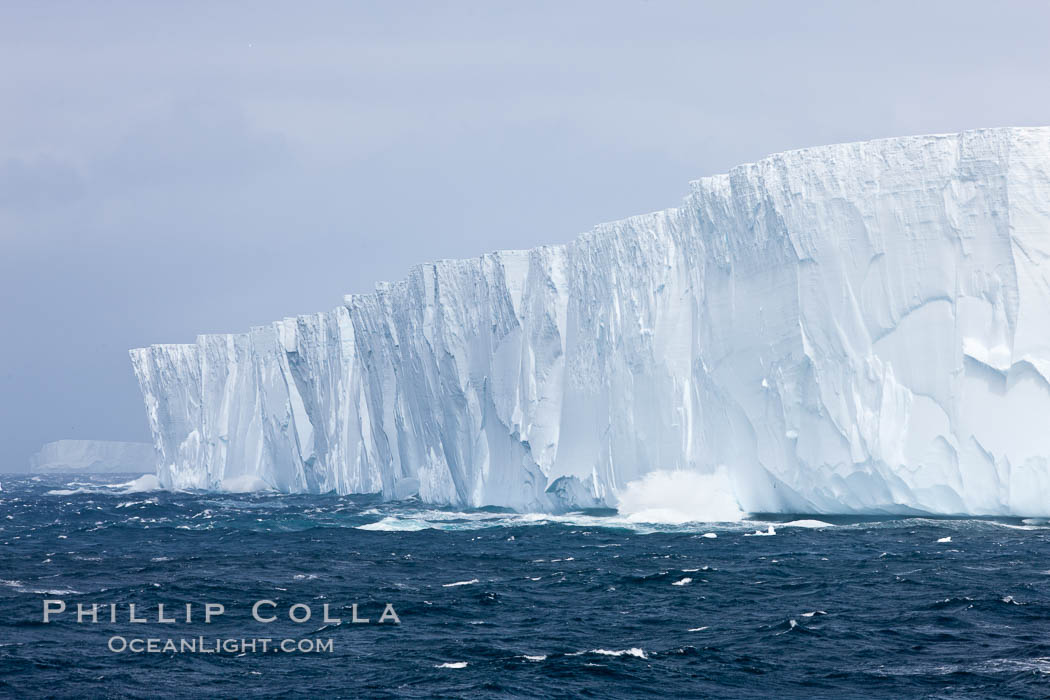 Tabular iceberg.  The edge of a huge tabular iceberg.  Tabular icebergs can be dozens or hundreds of miles in size, have flat tops and sheer sides. Scotia Sea, Southern Ocean, natural history stock photograph, photo id 24847