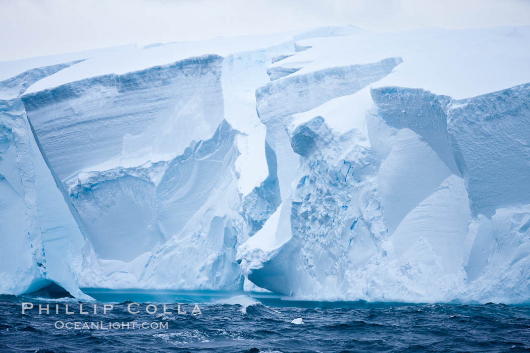 Tabular iceberg.  The edge of a huge tabular iceberg.  Tabular icebergs can be dozens or hundreds of miles in size, have flat tops and sheer sides. Scotia Sea, Southern Ocean, natural history stock photograph, photo id 24793