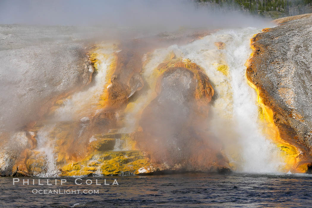 Thermophilac heat-loving bacteria color the runoff canals from Excelsior Geyser as it empties into the Firehole River. Midway Geyser Basin, Yellowstone National Park, Wyoming, USA, natural history stock photograph, photo id 13596