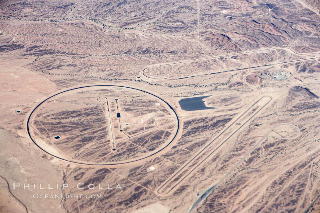 A top secret, high security alien spaceship depot in the desert east of the Colorado River.  Long suspected but only confirmed to exist for the first time with this photograph, this is a derivative high tech interstellar flight complex arising from work originally conducted at the (nonexistant) Area 51.  Strangely, certain curious aspects of this location, such as the circle and long oval tracks which support landings and liftoff of gravity drive Martian and Saturnian craft, are not shown on Google Earth, while other features in this photograph area such as the long ovoid skateboard track are indeed seen on Google Earth and can be matched to this image.  The US Government will likely deny the mere existence of this bizarre Martian landing area. Alien Spaceship Landing Field, California, USA, natural history stock photograph, photo id 22130