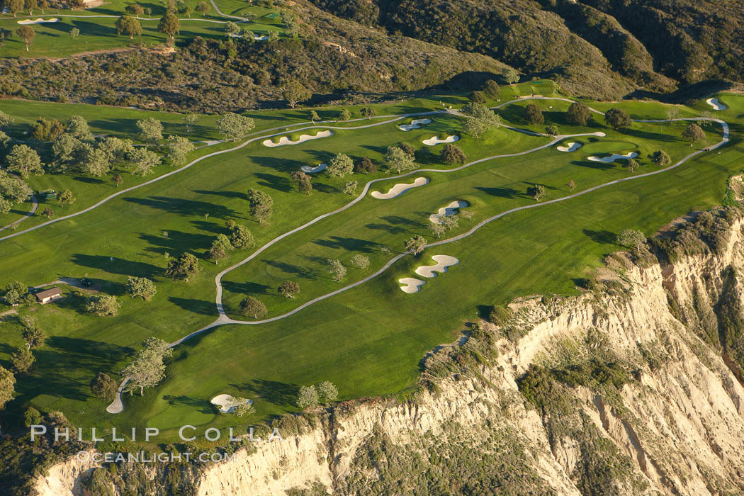 Torrey Pines Golf Course, south course holes 2, 4 and 5.  Torrey Pines golf course, situated atop the magnificent 300 foot tall seacliffs, offers majestic views of the Pacific Ocean south to La Jolla.  Scattered around the course are found Torrey pine trees, one of the rare species of pines in the world. San Diego, California, USA, natural history stock photograph, photo id 22312