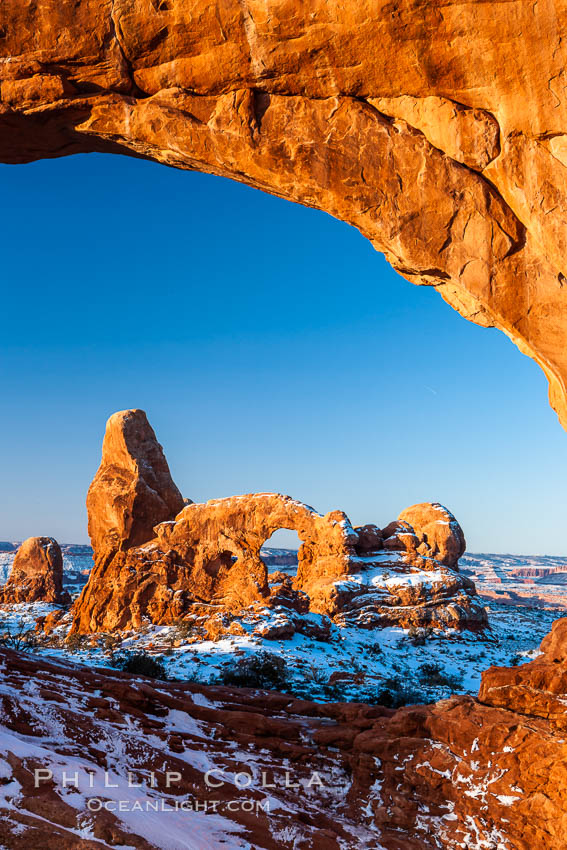 Sunrise light on Turret Arch viewed through North Window, winter. Arches National Park, Utah, USA, natural history stock photograph, photo id 18119