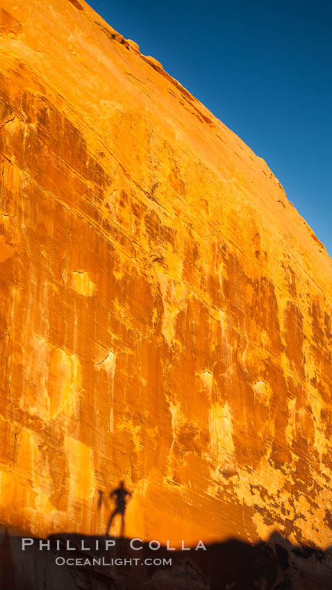 Rising sun creates the photographers shadow on a sandstone wall. Valley of Fire State Park, Nevada, USA, natural history stock photograph, photo id 26474