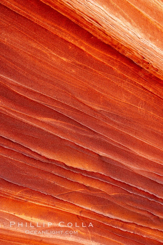The Wave, an area of fantastic eroded sandstone featuring beautiful swirls, wild colors, countless striations, and bizarre shapes set amidst the dramatic surrounding North Coyote Buttes of Arizona and Utah.  The sandstone formations of the North Coyote Buttes, including the Wave, date from the Jurassic period. Managed by the Bureau of Land Management, the Wave is located in the Paria Canyon-Vermilion Cliffs Wilderness and is accessible on foot by permit only. USA, natural history stock photograph, photo id 20639