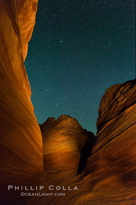 The Wave at Night, under a clear night sky full of stars.  The Wave, an area of fantastic eroded sandstone featuring beautiful swirls, wild colors, countless striations, and bizarre shapes set amidst the dramatic surrounding North Coyote Buttes of Arizona and Utah. The sandstone formations of the North Coyote Buttes, including the Wave, date from the Jurassic period. Managed by the Bureau of Land Management, the Wave is located in the Paria Canyon-Vermilion Cliffs Wilderness and is accessible on foot by permit only. USA, natural history stock photograph, photo id 28624