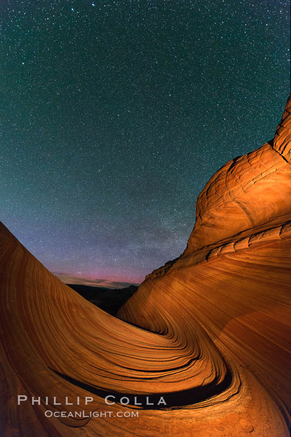The Wave at Night, under a clear night sky full of stars. The Wave, an area of fantastic eroded sandstone featuring beautiful swirls, wild colors, countless striations, and bizarre shapes set amidst the dramatic surrounding North Coyote Buttes of Arizona and Utah. The sandstone formations of the North Coyote Buttes, including the Wave, date from the Jurassic period. Managed by the Bureau of Land Management, the Wave is located in the Paria Canyon-Vermilion Cliffs Wilderness and is accessible on foot by permit only