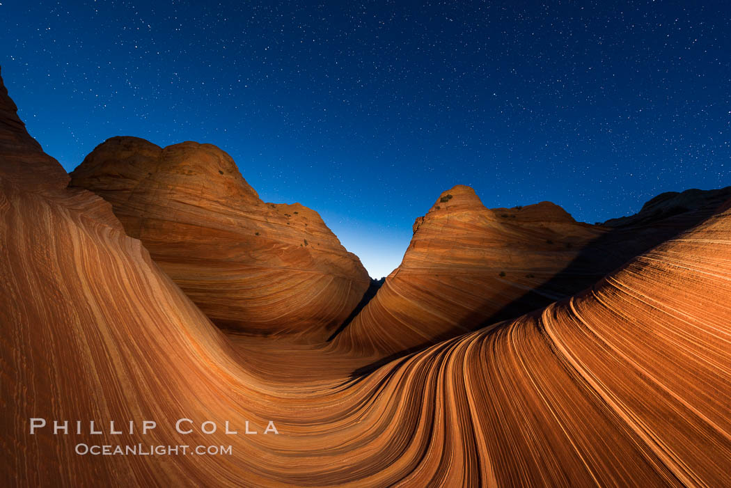 The Wave at Night, under a clear night sky full of stars.  The Wave, an area of fantastic eroded sandstone featuring beautiful swirls, wild colors, countless striations, and bizarre shapes set amidst the dramatic surrounding North Coyote Buttes of Arizona and Utah. The sandstone formations of the North Coyote Buttes, including the Wave, date from the Jurassic period. Managed by the Bureau of Land Management, the Wave is located in the Paria Canyon-Vermilion Cliffs Wilderness and is accessible on foot by permit only. USA, natural history stock photograph, photo id 28625