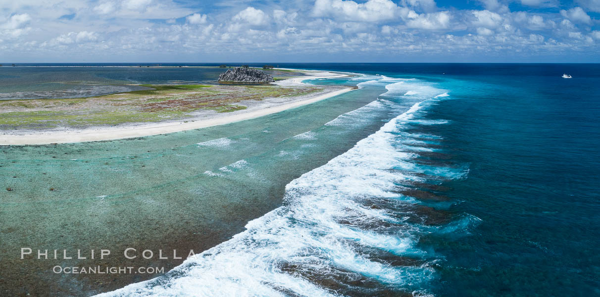 Waves break on the coral reef and wash ashore at Clipperton Island, aerial photo. Clipperton Island, a minor territory of France also known as Ile de la Passion, is a spectacular coral atoll in the eastern Pacific. By permit HC / 1485 / CAB (France)., natural history stock photograph, photo id 32832