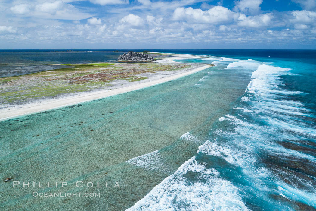 Waves break on the coral reef and wash ashore at Clipperton Island, aerial photo. Clipperton Island, a minor territory of France also known as Ile de la Passion, is a spectacular coral atoll in the eastern Pacific. By permit HC / 1485 / CAB (France)., natural history stock photograph, photo id 32831