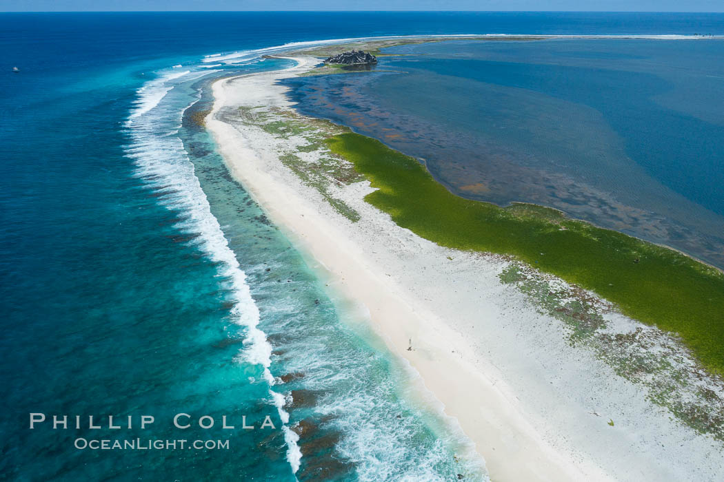Waves break on the coral reef and wash ashore at Clipperton Island, aerial photo. Clipperton Island, a minor territory of France also known as Ile de la Passion, is a spectacular coral atoll in the eastern Pacific. By permit HC / 1485 / CAB (France)., natural history stock photograph, photo id 32923