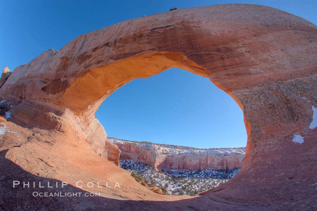 Wilson Arch rises high above route 191 in eastern Utah, with a span of 91 feet and a height of 46 feet. USA, natural history stock photograph, photo id 18035