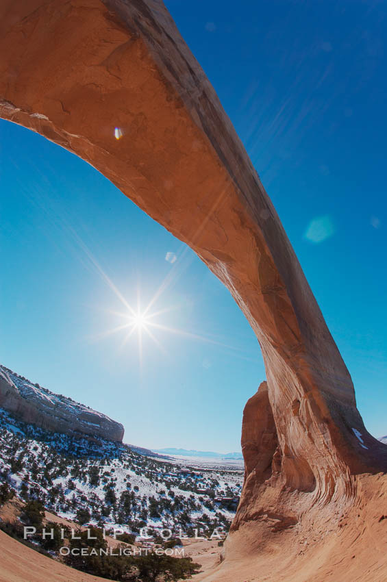 Wilson Arch rises high above route 191 in eastern Utah, with a span of 91 feet and a height of 46 feet. USA, natural history stock photograph, photo id 18033