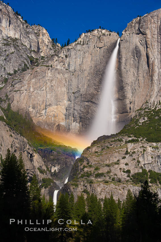 Upper Yosemite Falls and lunar rainbow, moonbow. A lunar rainbow (moonbow) can be seen to the left of Yosemite Falls, where the moon illuminates the spray of the falls. Yosemite National Park, California, USA, natural history stock photograph, photo id 27752