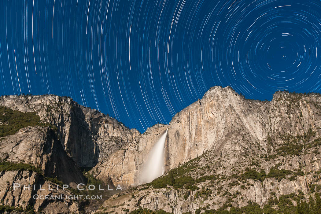 Yosemite Falls and star trails, at night, viewed from Cook's Meadow, illuminated by the light of the full moon, Yosemite National Park, California