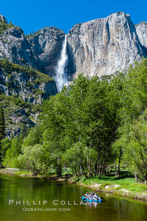 Rafters enjoy a Spring day on the Merced River in Yosemite Valley, with Yosemite Falls in the background. Yosemite National Park, California, USA, natural history stock photograph, photo id 09214