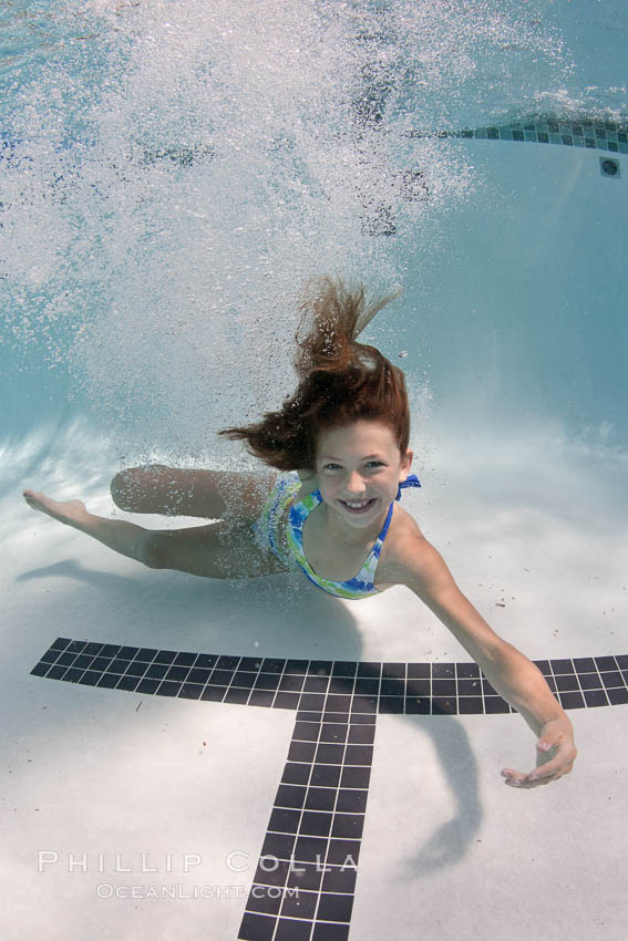 Young girl swimming in a pool., natural history stock photograph, photo id 25286