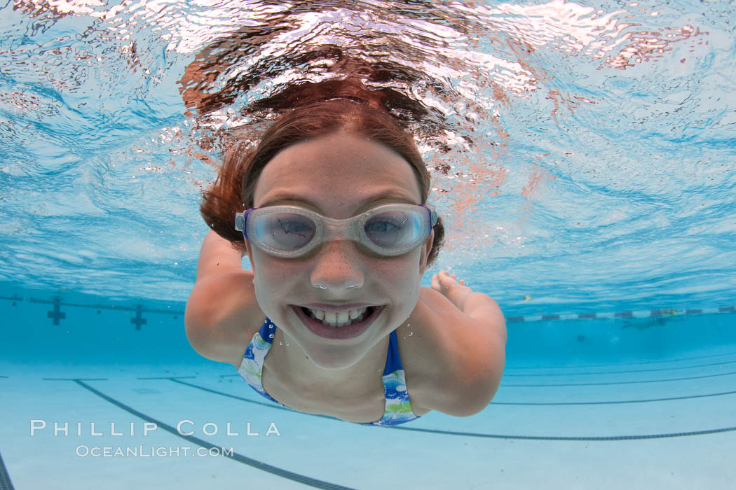 Young girl swimming in a pool