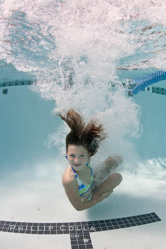 Young girl swimming in a pool., natural history stock photograph, photo id 25287