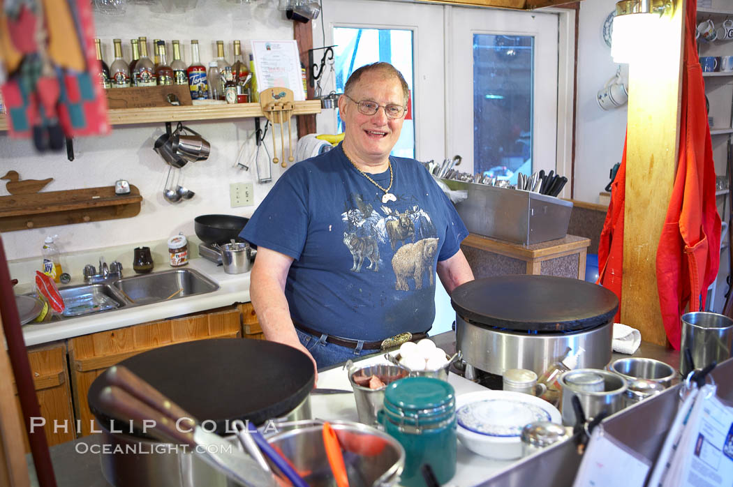 Yvon van Driessche, owner and chef at his crepe table, Le Barn Appetit, creperie and inn. Seward, Alaska, USA, natural history stock photograph, photo id 18998