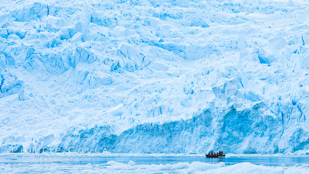 Zodiac cruising in Antarctica.  Tourists enjoy the pack ice and towering glaciers of Cierva Cove on the Antarctic Peninsula., natural history stock photograph, photo id 25591