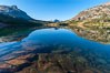 Sunrise reflections in Tioga Lake. This spectacular location is just a short walk from the Tioga Pass road. Near Tuolumne Meadows and Yosemite National Park. California, USA. Image #09951