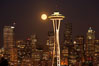Full moon rises over Seattle city skyline, Space Needle at right. Washington, USA. Image #13662