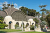 The Botanical Building in Balboa Park, San Diego.  The Botanical Building, at 250 feet long by 75 feet wide and 60 feet tall, was the largest wood lath structure in the world when it was built in 1915 for the Panama-California Exposition. The Botanical Building, located on the Prado, west of the Museum of Art, contains about 2,100 permanent tropical plants along with changing seasonal flowers. The Lily Pond, just south of the Botanical Building, is an eloquent example of the use of reflecting pools to enhance architecture. The 193 by 43 foot pond and smaller companion pool were originally referred to as Las Lagunas de las Flores (The Lakes of the Flowers) and were designed as aquatic gardens. The pools contain exotic water lilies and lotus which bloom spring through fall.  Balboa Park, San Diego. USA. Image #14579