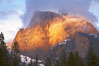 Half Dome and storm clouds at sunset, viewed from Sentinel Bridge. Yosemite National Park, California, USA