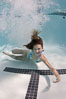 Young girl swimming in a pool. Image #25286