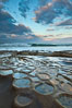 Waves wash over sandstone reef, clouds and sky. La Jolla, California, USA. Image #26337