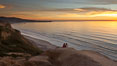 Sunset falls upon Torrey Pines State Reserve, viewed from the Torrey Pines glider port.  La Jolla, Scripps Institution of Oceanography and Scripps Pier are seen in the distance. California, USA. Image #26435