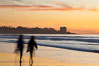 Tourists walk along La Jolla Shores beach at sunset.  Point La Jolla is visible in the distance. Scripps Institution of Oceanography, California, USA. Image #26533