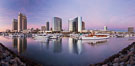 Panoramic photo of San Diego embarcadero, showing the San Diego Marriott Hotel and Marina (center), Roy's Restaurant (center) and Manchester Grand Hyatt Hotel (left) viewed from the San Diego Embarcadero Marine Park. California, USA. Image #26566