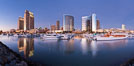 Panoramic photo of San Diego embarcadero, showing the San Diego Marriott Hotel and Marina (center), Roy's Restaurant (center) and Manchester Grand Hyatt Hotel (left) viewed from the San Diego Embarcadero Marine Park. California, USA. Image #26568