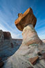 Pedestal rock, or hoodoo, at Stud Horse Point.  These hoodoos form when erosion occurs around but not underneath a more resistant caprock that sits atop of the hoodoo spire. Page, Arizona, USA. Image #26610