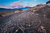 Sky Rock petroglyphs near Bishop, California.  Hidden atop an enormous boulder in the Volcanic Tablelands lies Sky Rock, a set of petroglyphs that face the sky.  These superb examples of native American petroglyph artwork are thought to be Paiute in origin, but little is known about them. USA. Image #27006