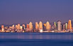 San Diego downtown city skyline and waterfront, sunset reflections and San Diego Bay. Earth-shadow (Belt of Venus) visible in the atmosphere. California, USA. Image #27103