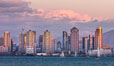San Diego city skyline, dusk, clearing storm clouds. California, USA. Image #28007