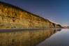 Torrey Pines Cliffs lit at night by a full moon, low tide reflections. Torrey Pines State Reserve, San Diego, California, USA. Image #28454