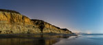Torrey Pines Cliffs lit at night by a full moon, low tide reflections. Torrey Pines State Reserve, San Diego, California, USA. Image #28455