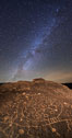 The Milky Way at Night over Sky Rock.  Sky Rock petroglyphs near Bishop, California. Hidden atop an enormous boulder in the Volcanic Tablelands lies Sky Rock, a set of petroglyphs that face the sky. These superb examples of native American petroglyph artwork are thought to be Paiute in origin, but little is known about them. USA. Image #28797