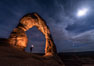 Delicate Arch with Stars and Moon, at night, Arches National Park. Utah, USA
